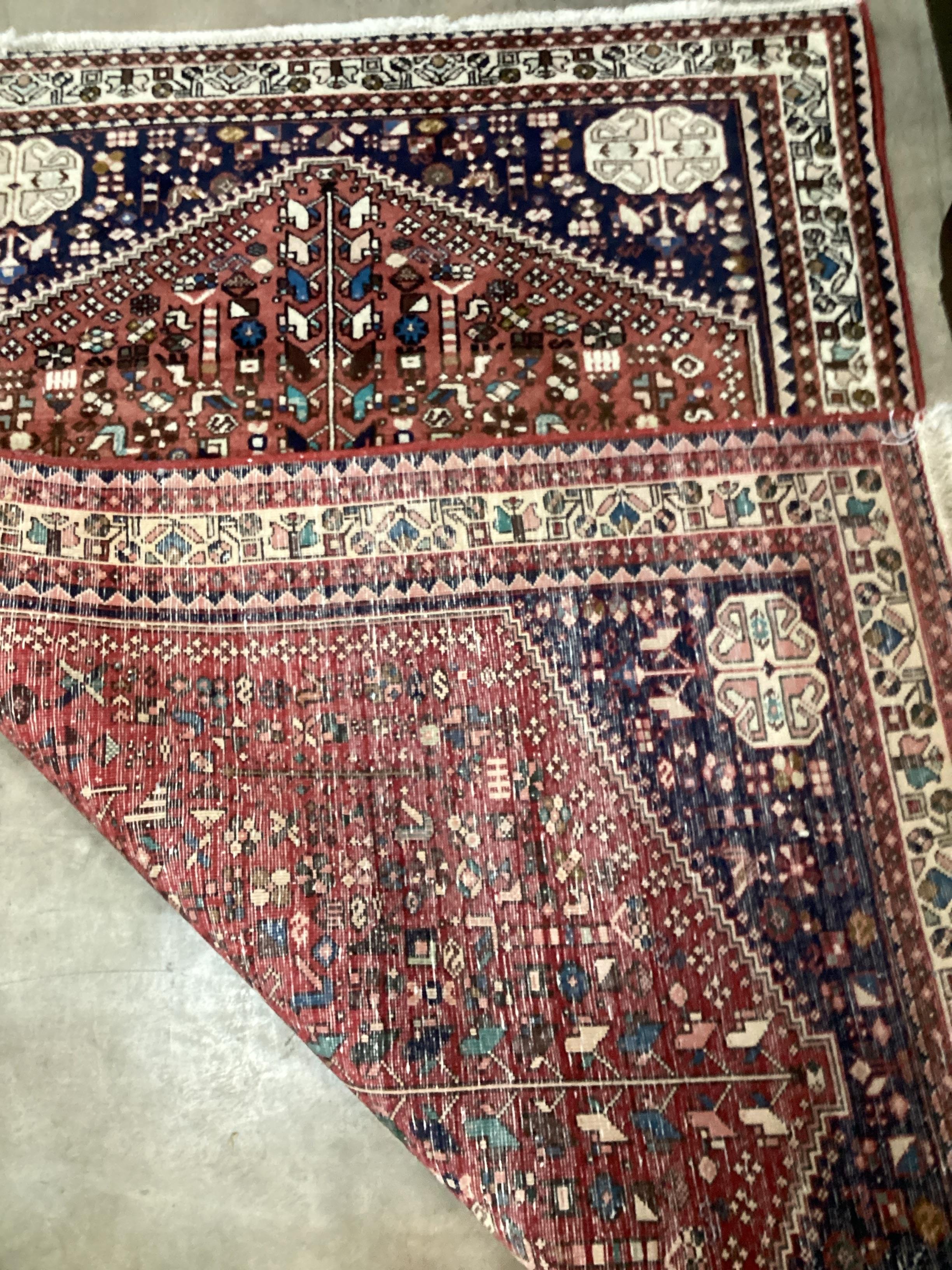 A North West Persian red ground rug, 151 x 105cm